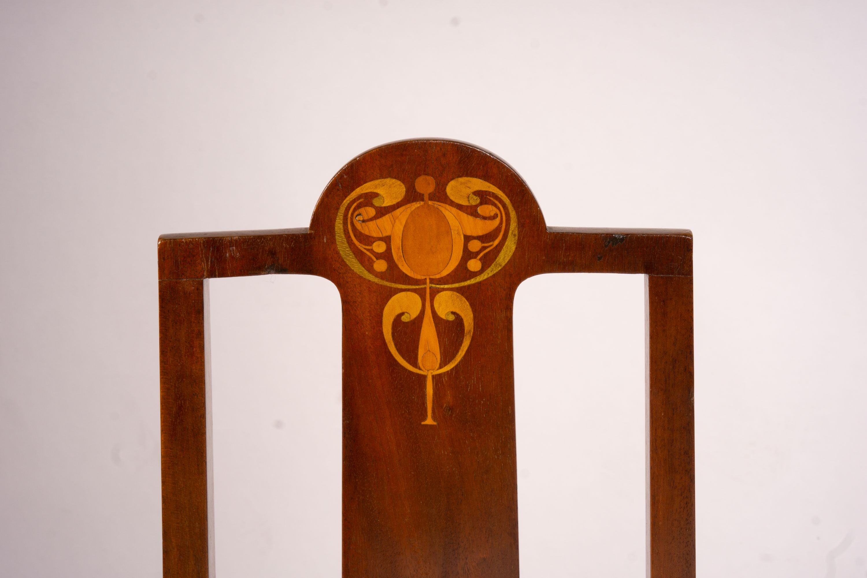 An Edwardian Art Nouveau inlaid mahogany towel rail and a pair of matching salon chairs (3)